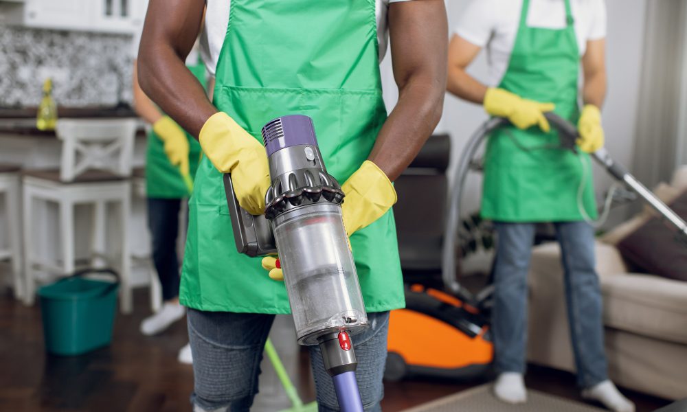 Close up of multiracial people doing cleaning of room