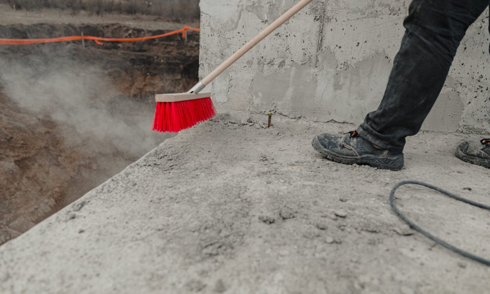 Closeup shot of a cleaning brush being used at the construction process