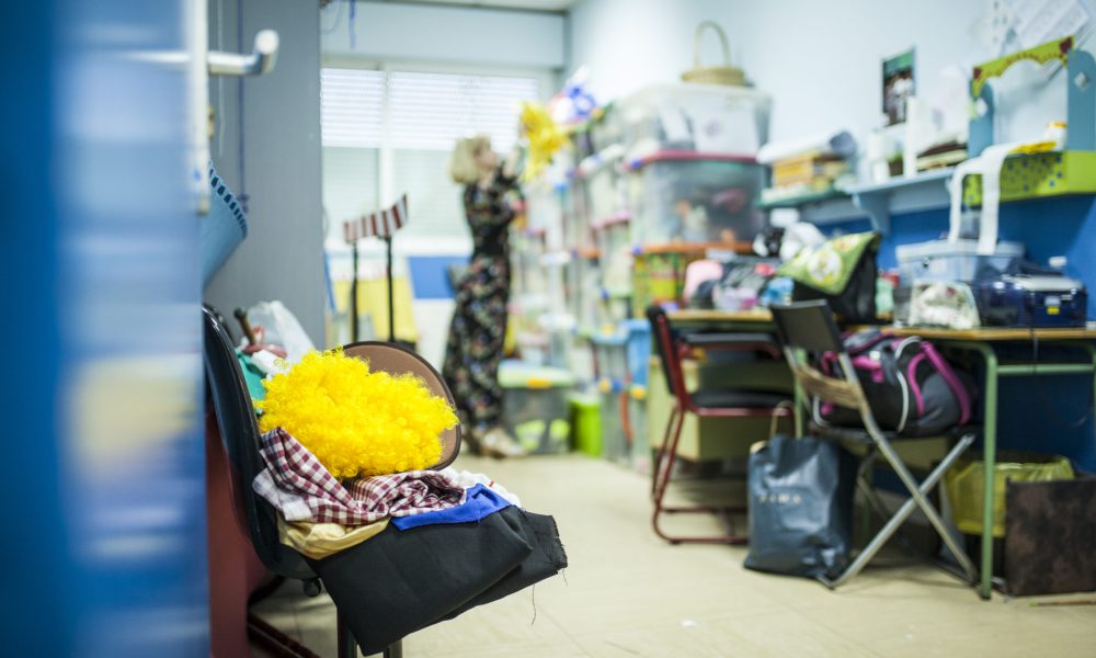 theater teacher looking at the school theater warehouse