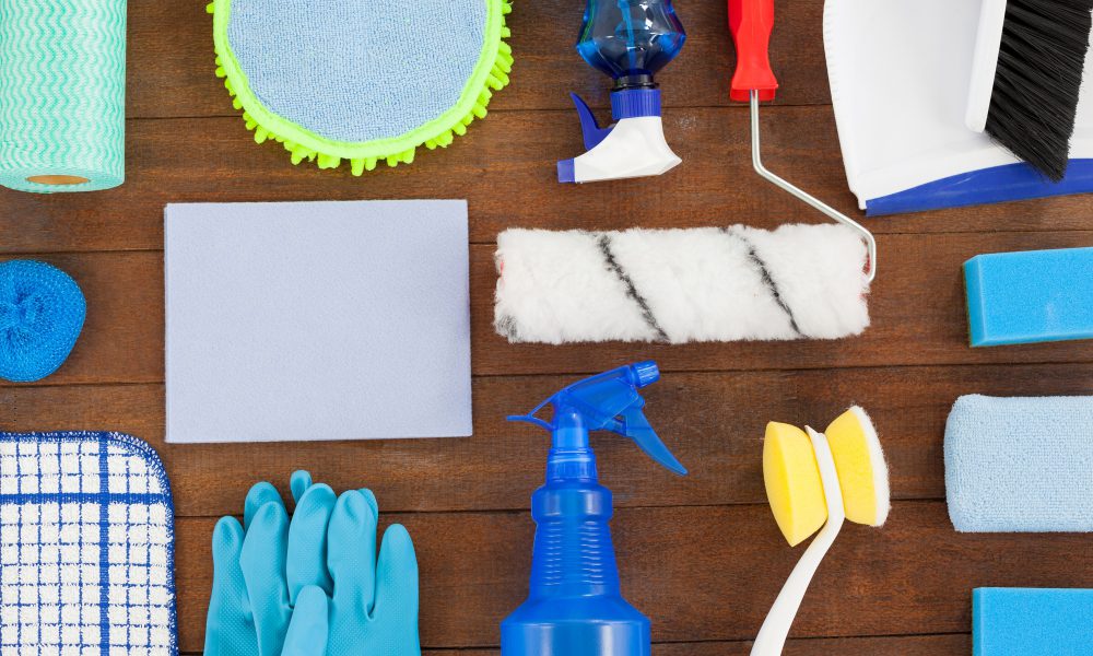 Various cleaning equipment arranged on wooden floor
