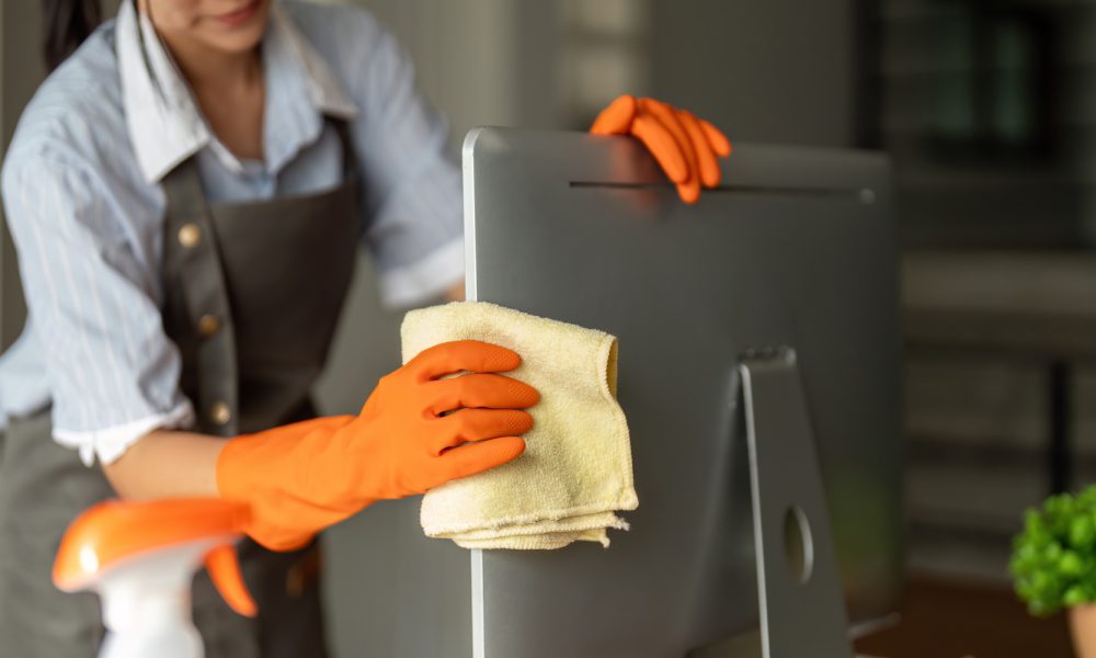 Woman clean in office room at office. Housekeeper or maid cleaner feel happy wipe mop and clean the